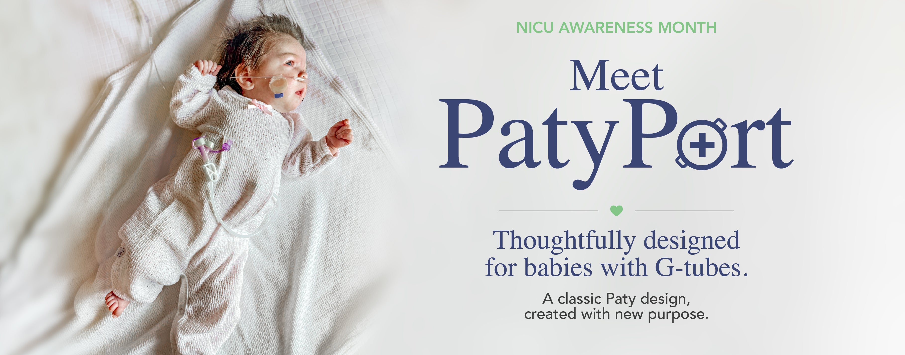 Baby wearing PatyPort G-tube clothing with discreet access for feeding and care